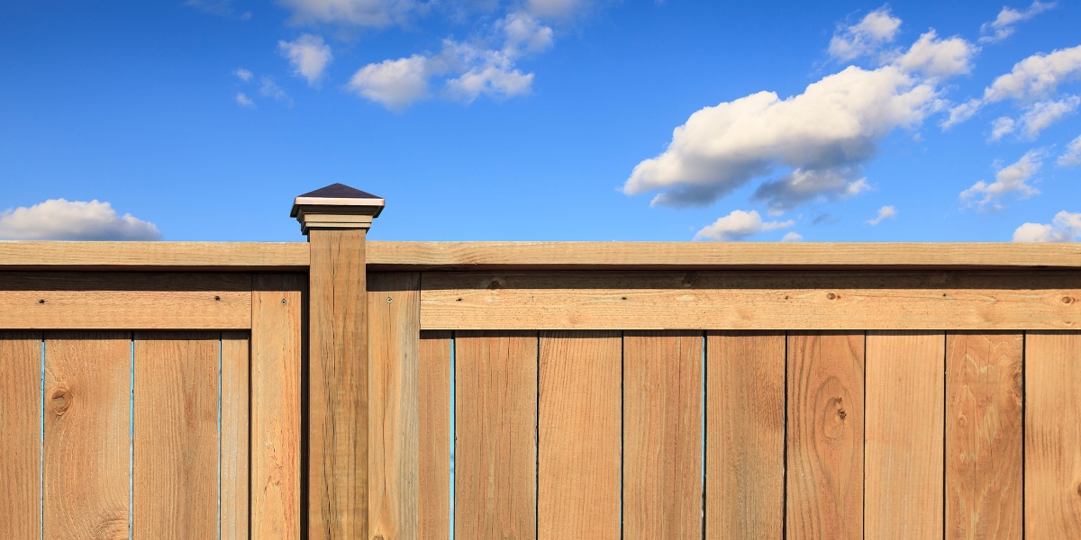 A wooden fence with a post cap in Big Bear
