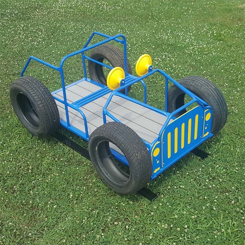 Blue and yellow toy car made of metal and tires, on green grass.