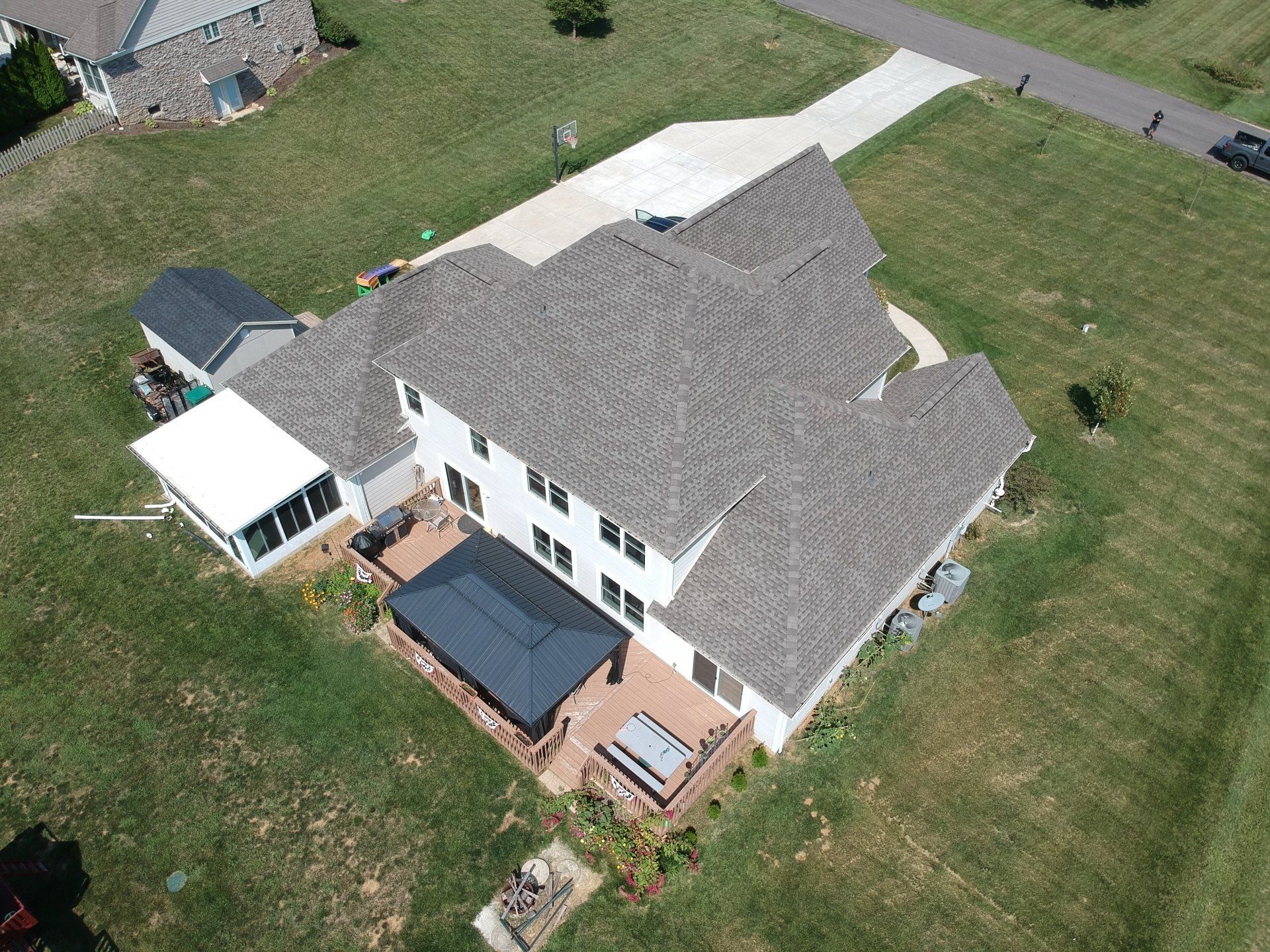 Roofer working on shingles