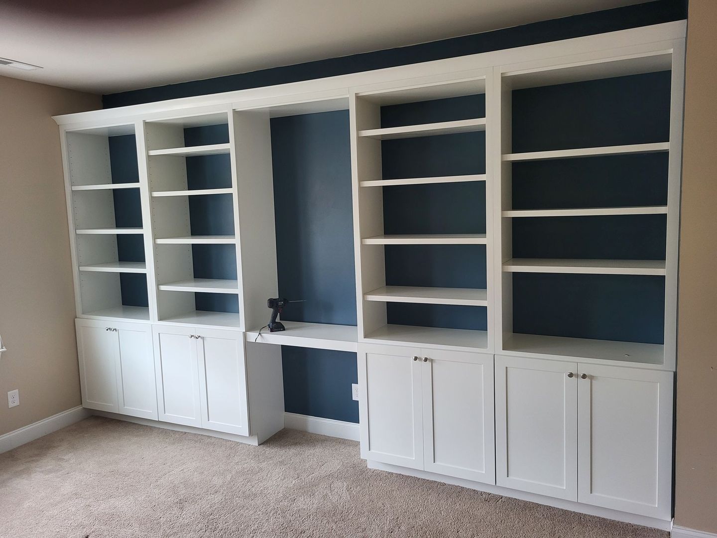 A room with a lot of shelves and cabinets