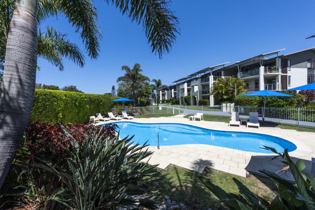 Swimming pool outside resort — Grounds Maintenance in Coffs Harbour, NSW