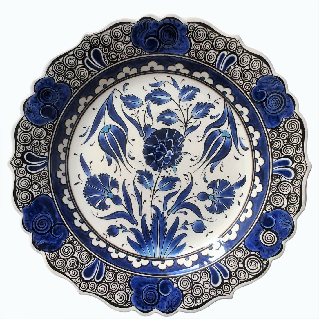 A blue and white plate with flowers on it