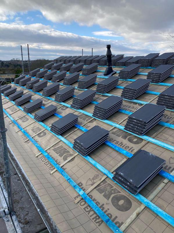 Roof tiles laid out on a roof waiting to be replaced