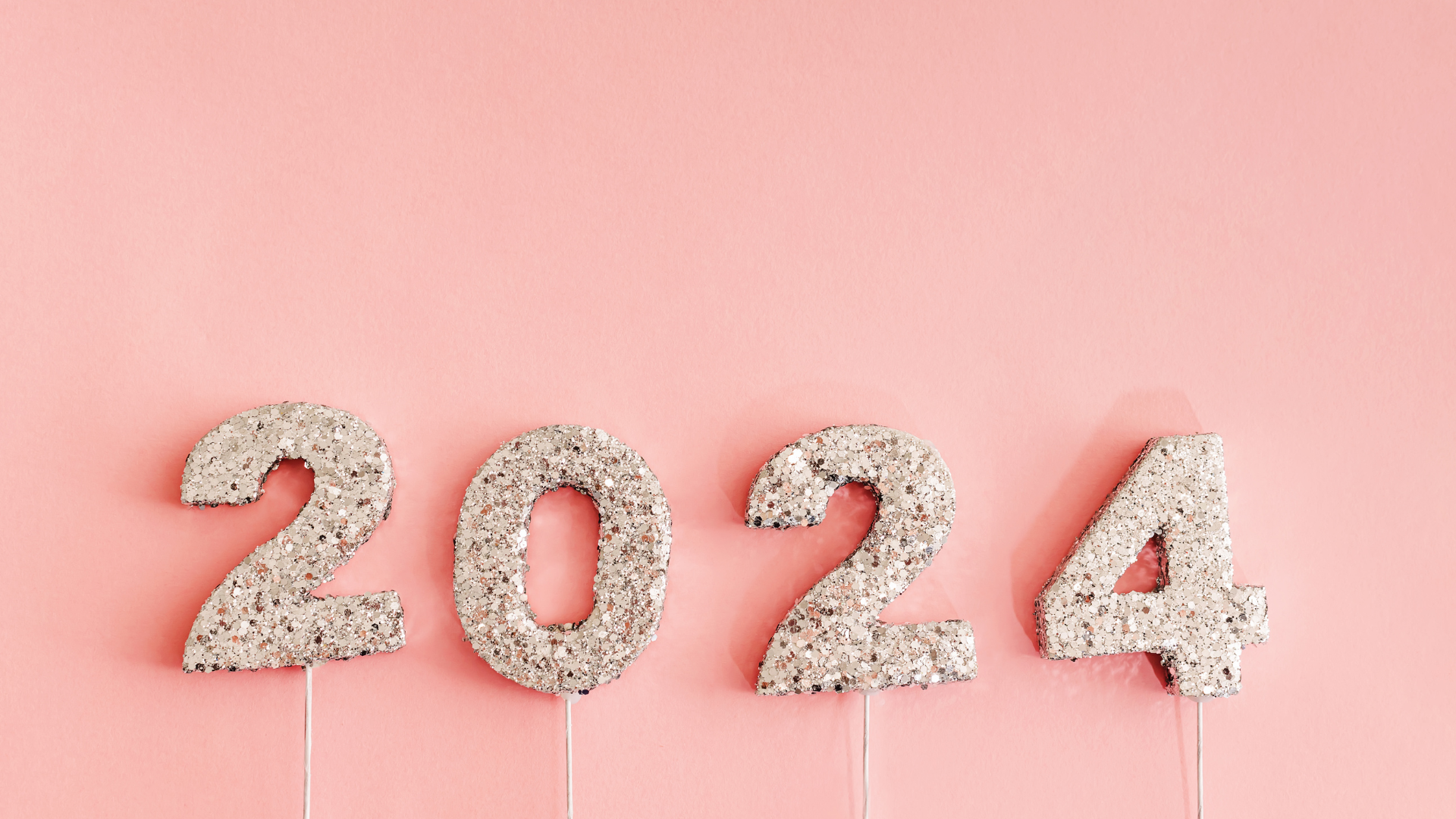 a peach background with 2024 glitter numbers