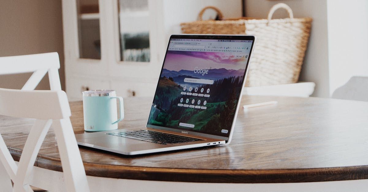 laptop and coffee cup on a tabletop