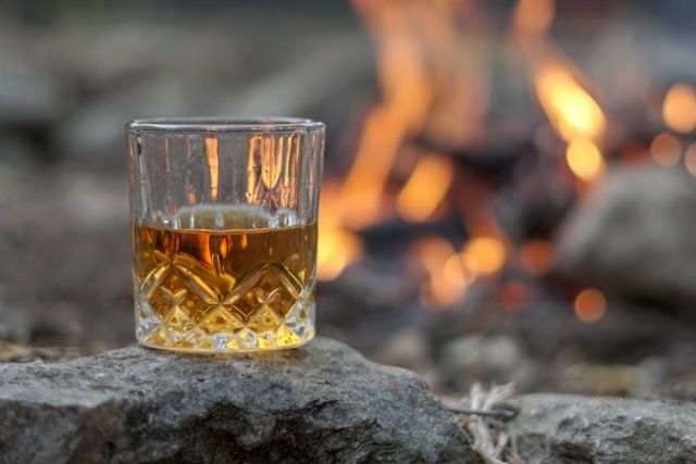 Glass of whisky by the fire.