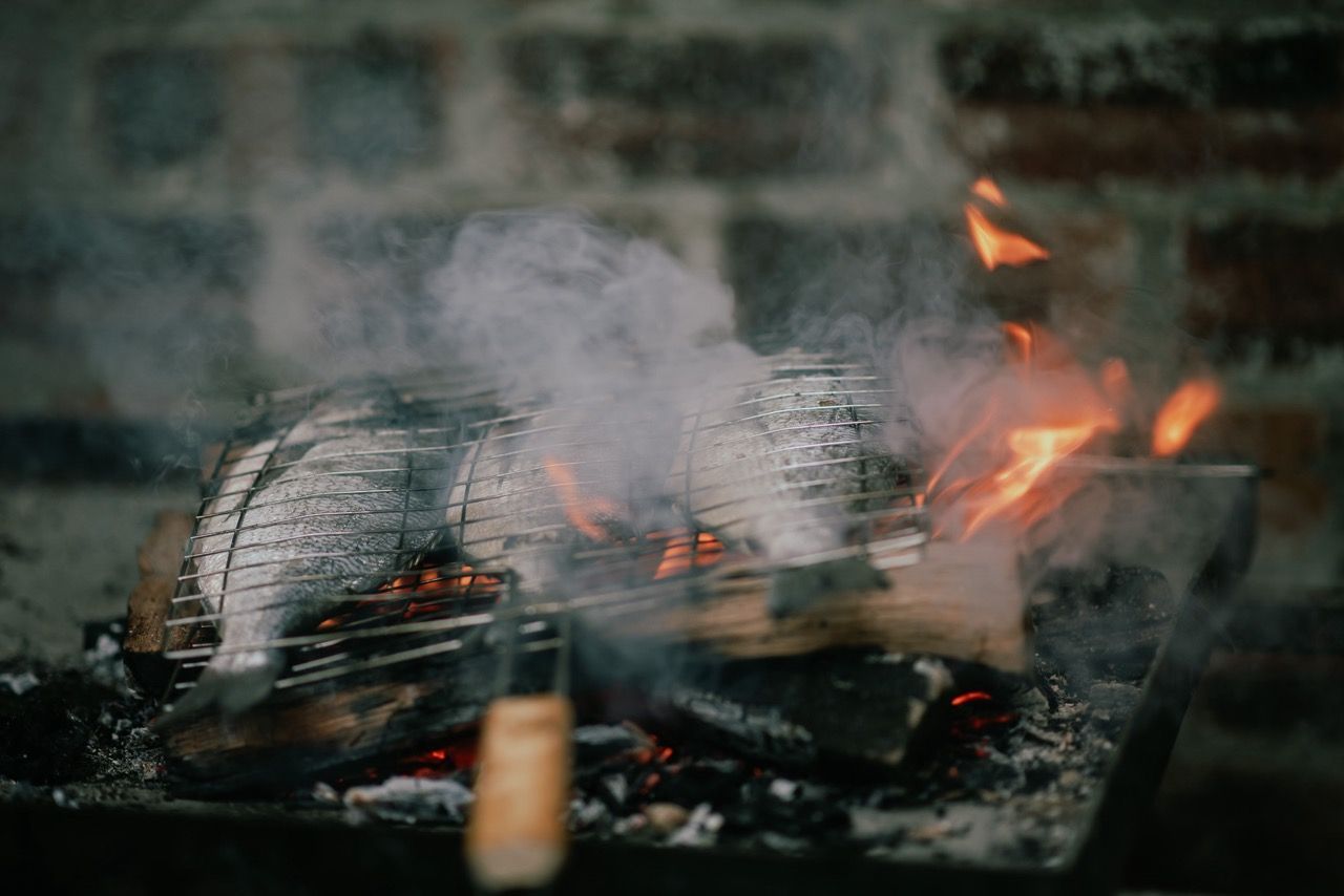 A fish on a grill.