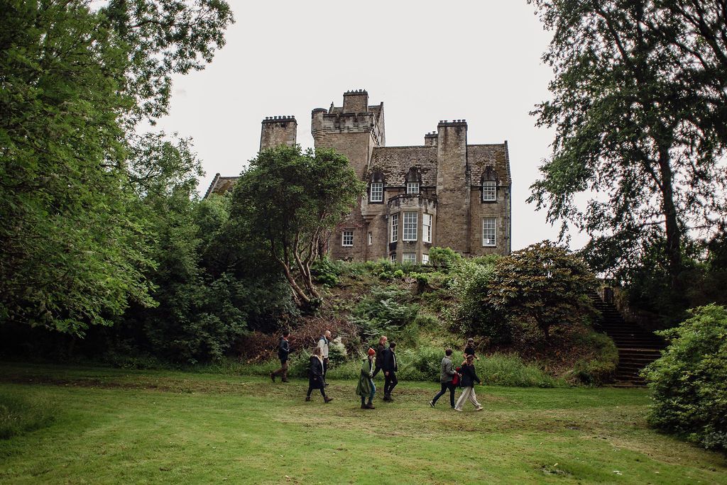 People walking in front of Ardkinglas Esate.