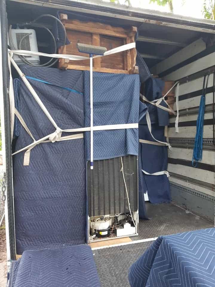 A Moving Truck Filled With Furniture And A Refrigerator — Byron Coast Removals In Mullumbimby, NSW
