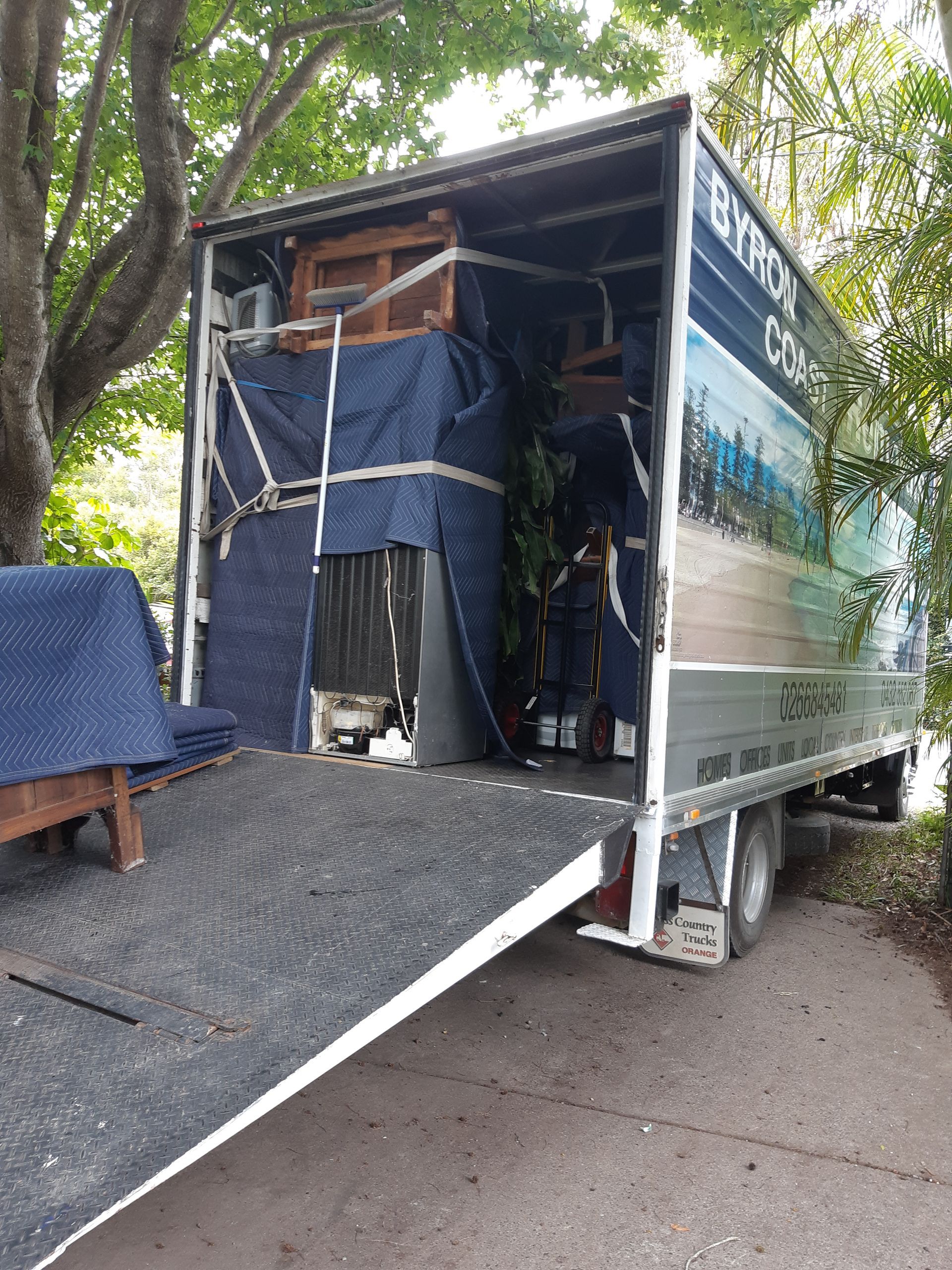 A Removalist Truck With The Back Open — Byron Coast Removals In Main Arm, NSW