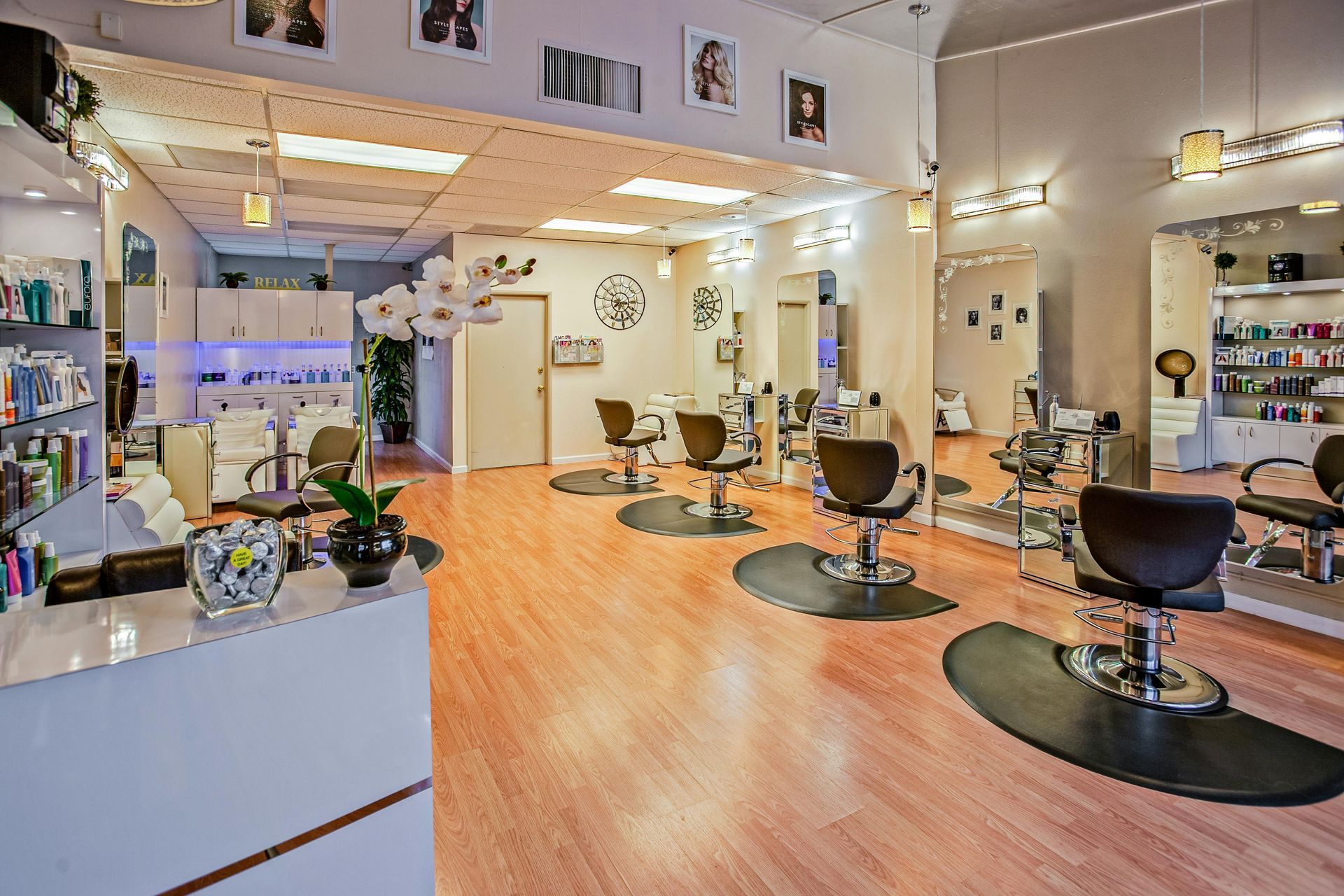 Clean and modern hair salon interior, illustrating culture and environment that help retain staff.”