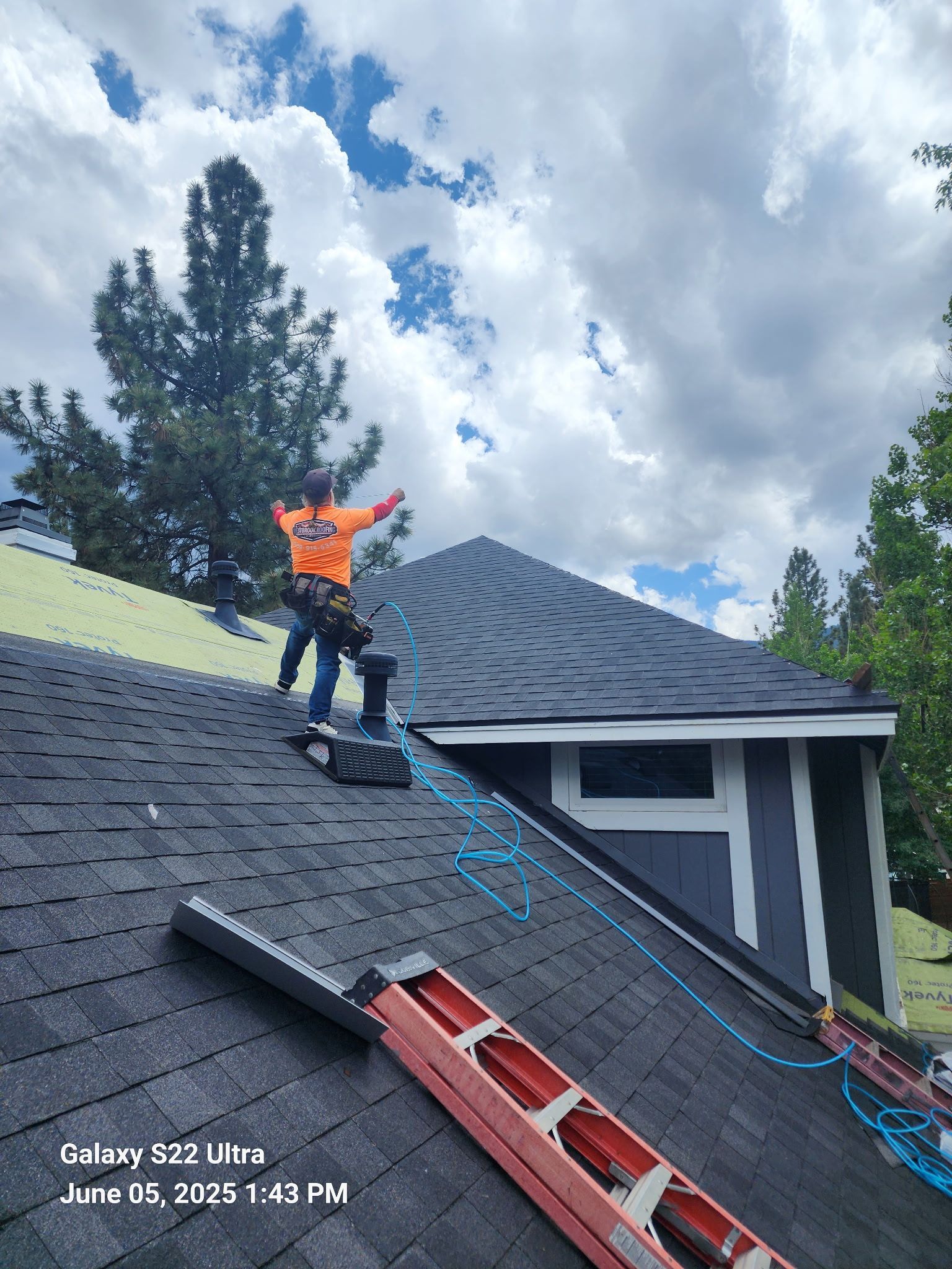 A house under construction with a ladder in front of it