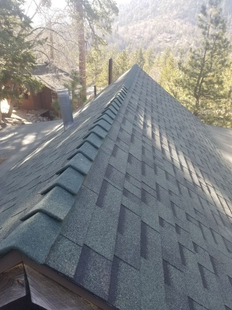 A close up of a roof with a lot of shingles on it.