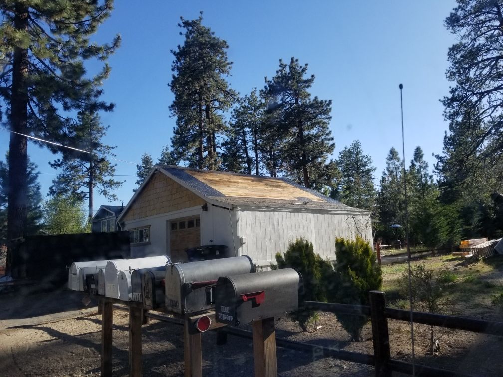 A row of mailboxes in front of a garage