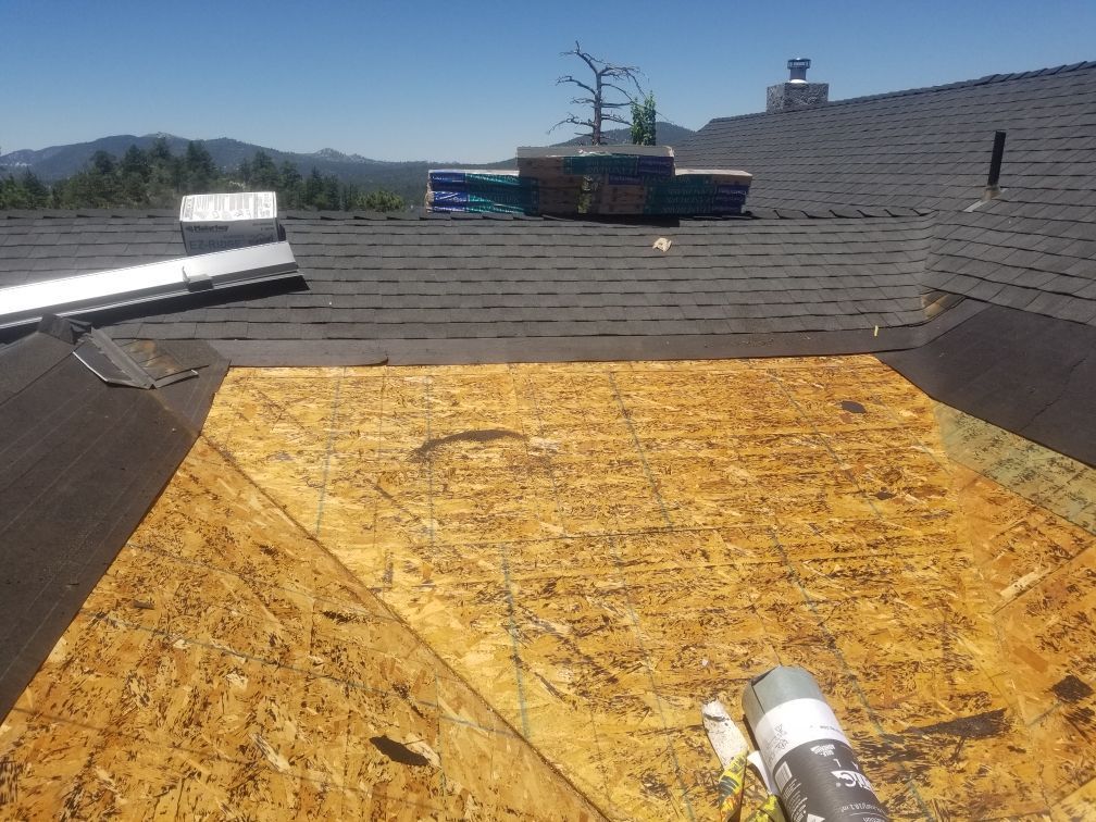 A roof with a bottle of sealant on it.