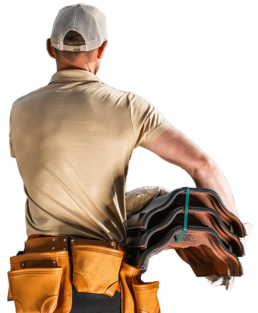 A man is carrying a stack of shingles on his back