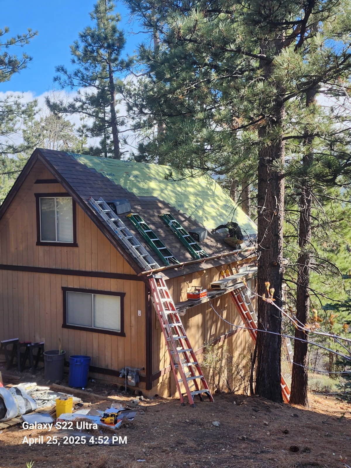 A house under construction with a ladder in front of it