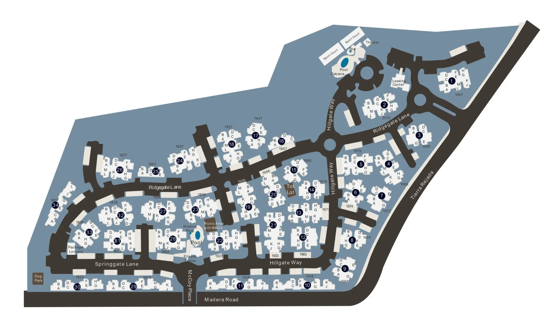 Map of a complex with roads, roundabouts, and buildings labeled with numbers. Gray and blue colors.
