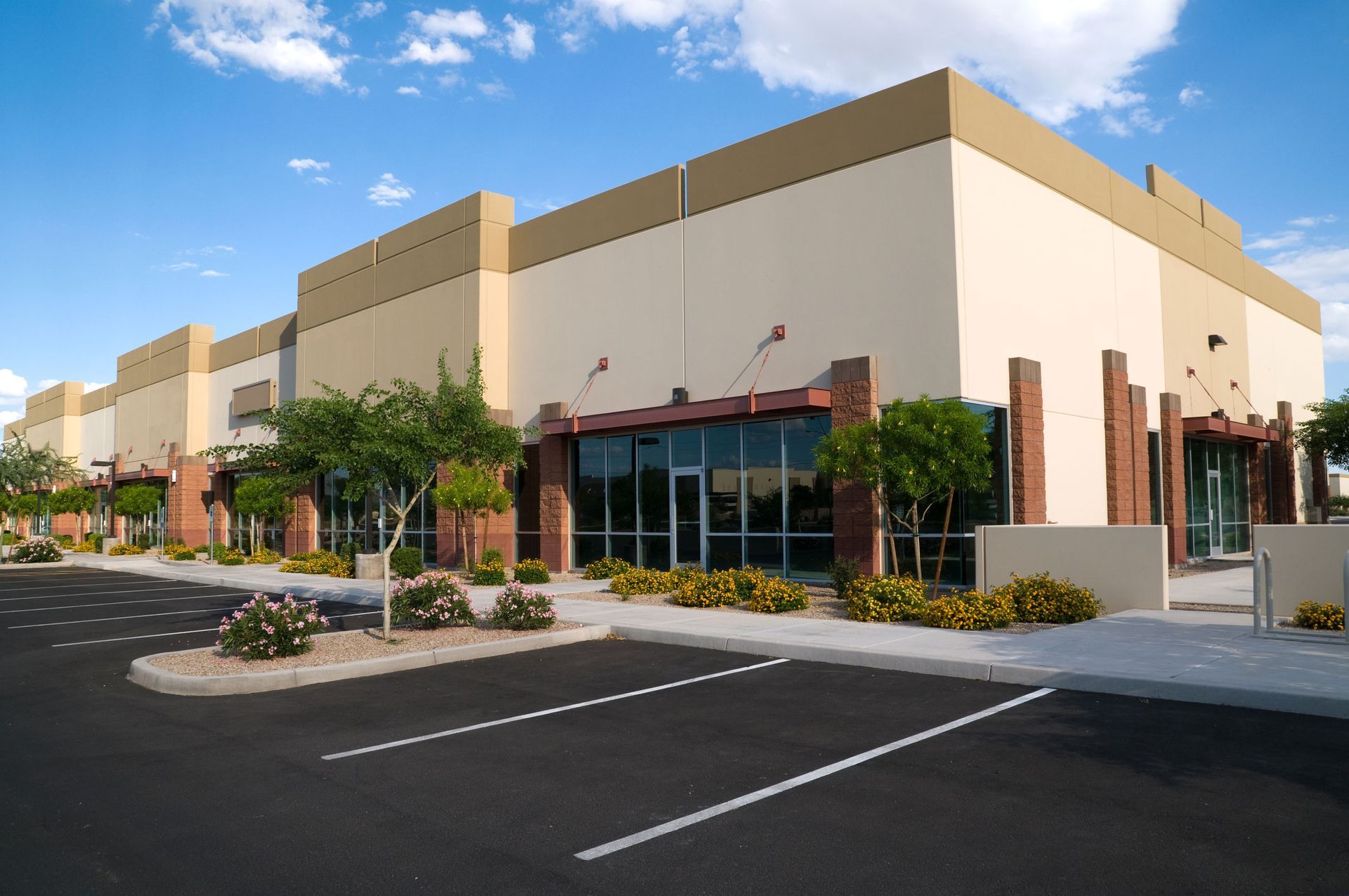 A large building with a parking lot in front of it