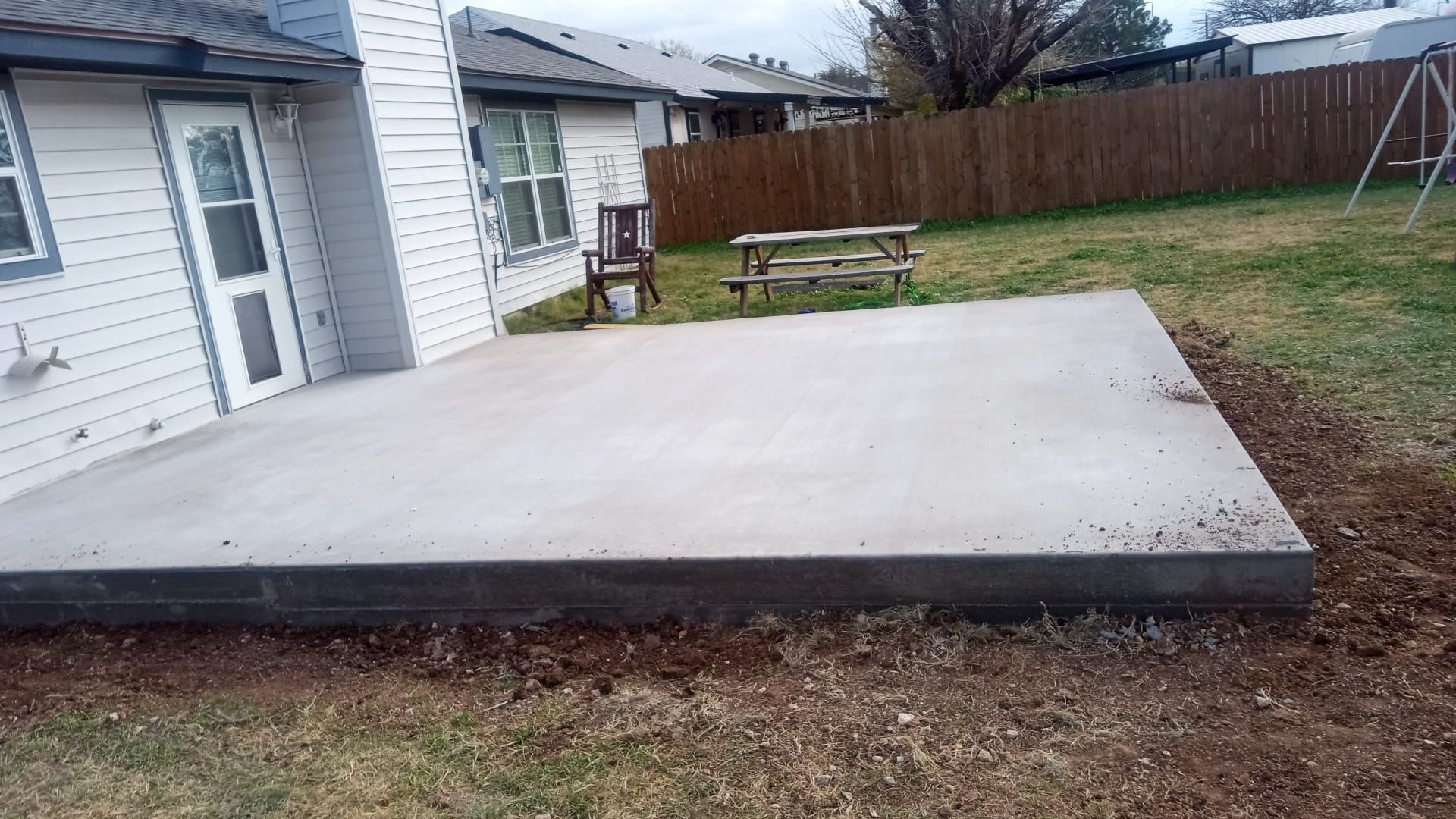 Concrete patio in Abilene, Texas residential area.