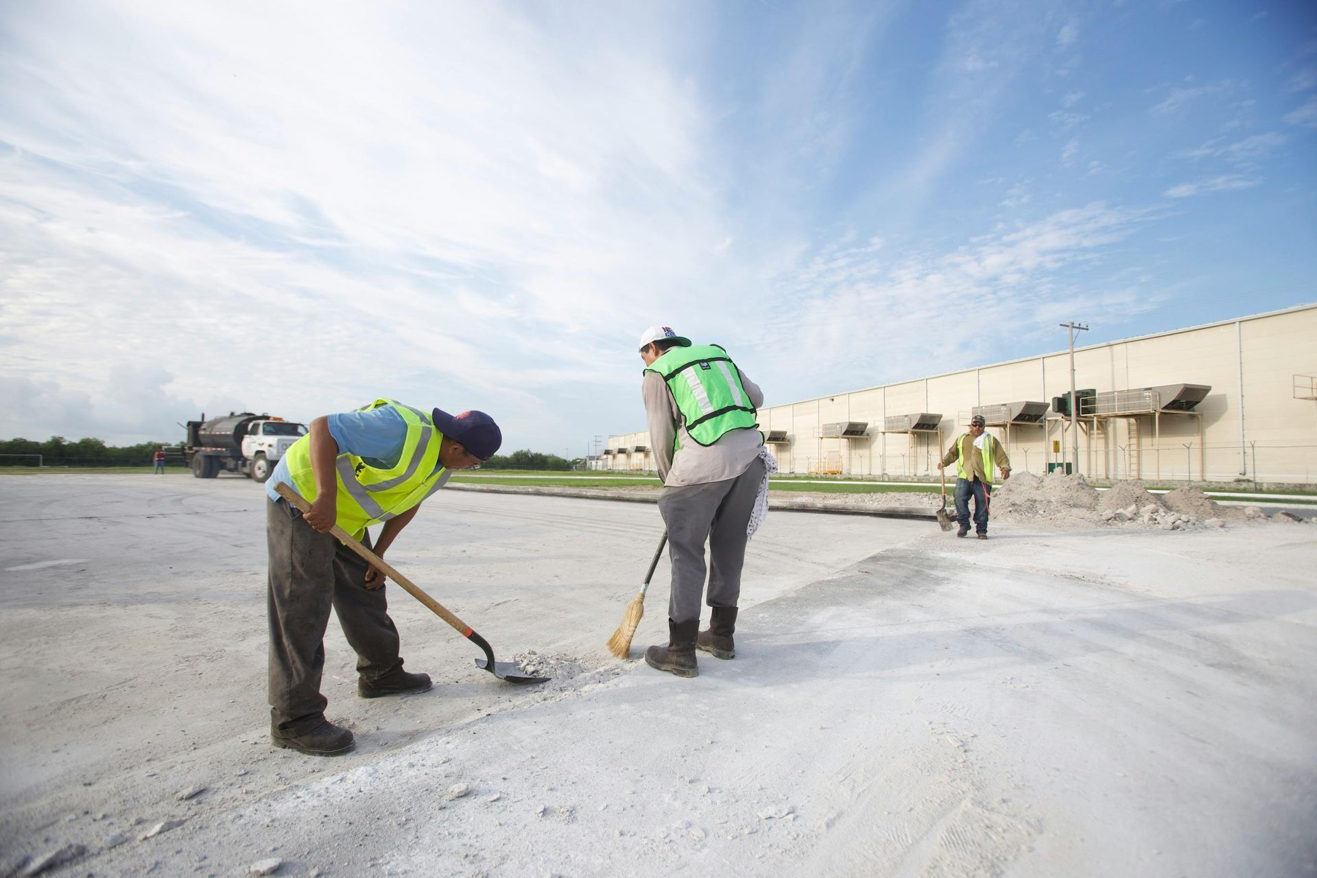 Men cleaning a concrete foundation - Abilene, Texas