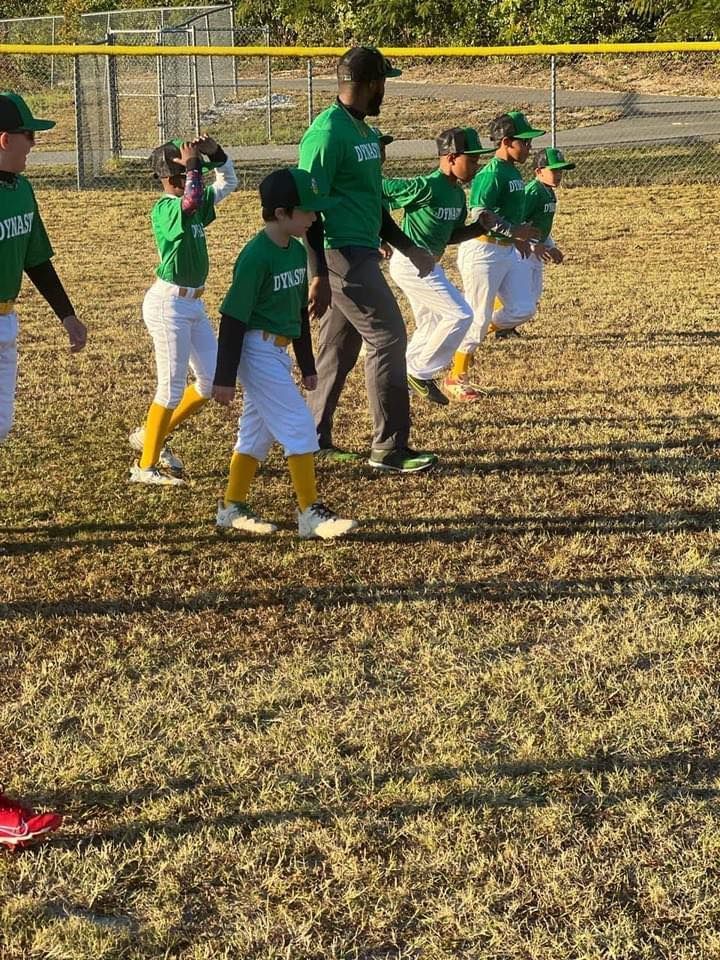 A group of young boys are playing baseball on a field.
