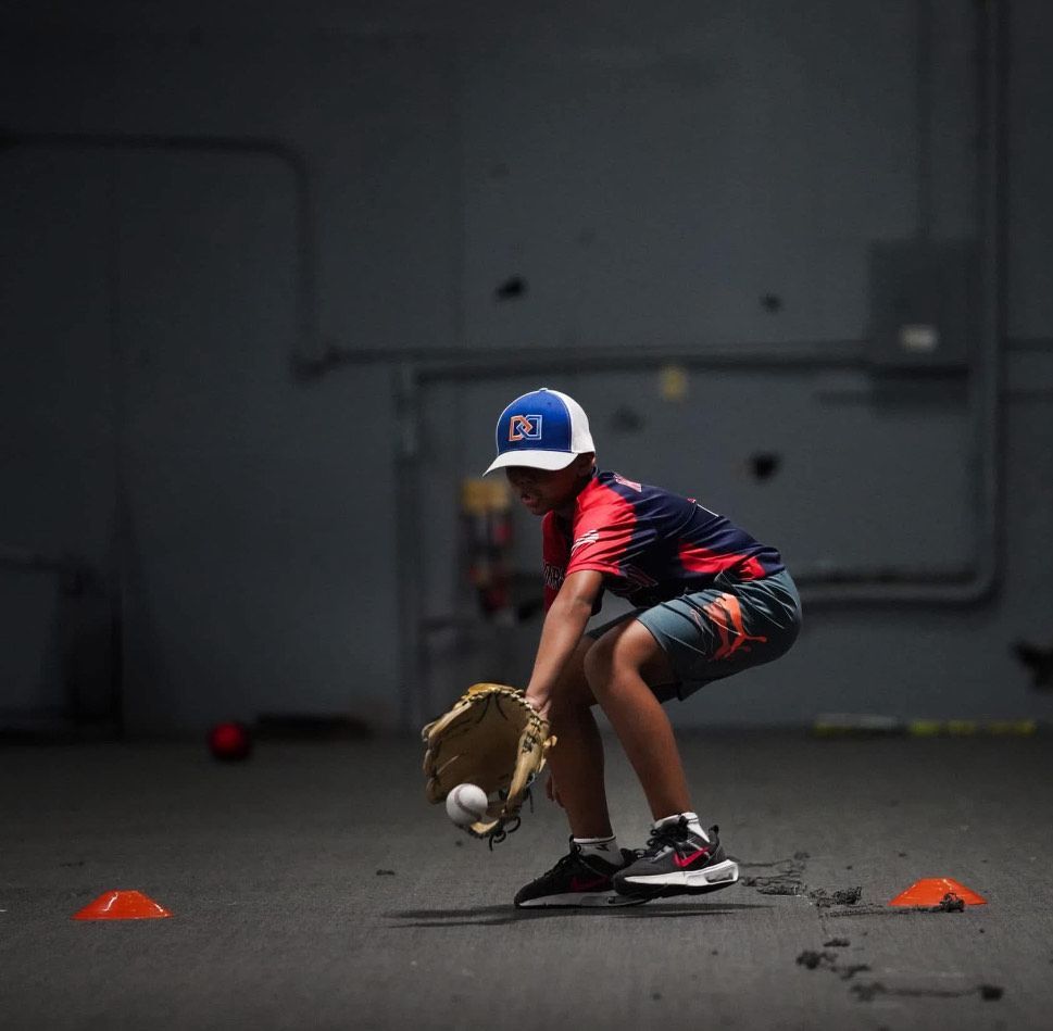 A young boy wearing a hat with the number 99 on it