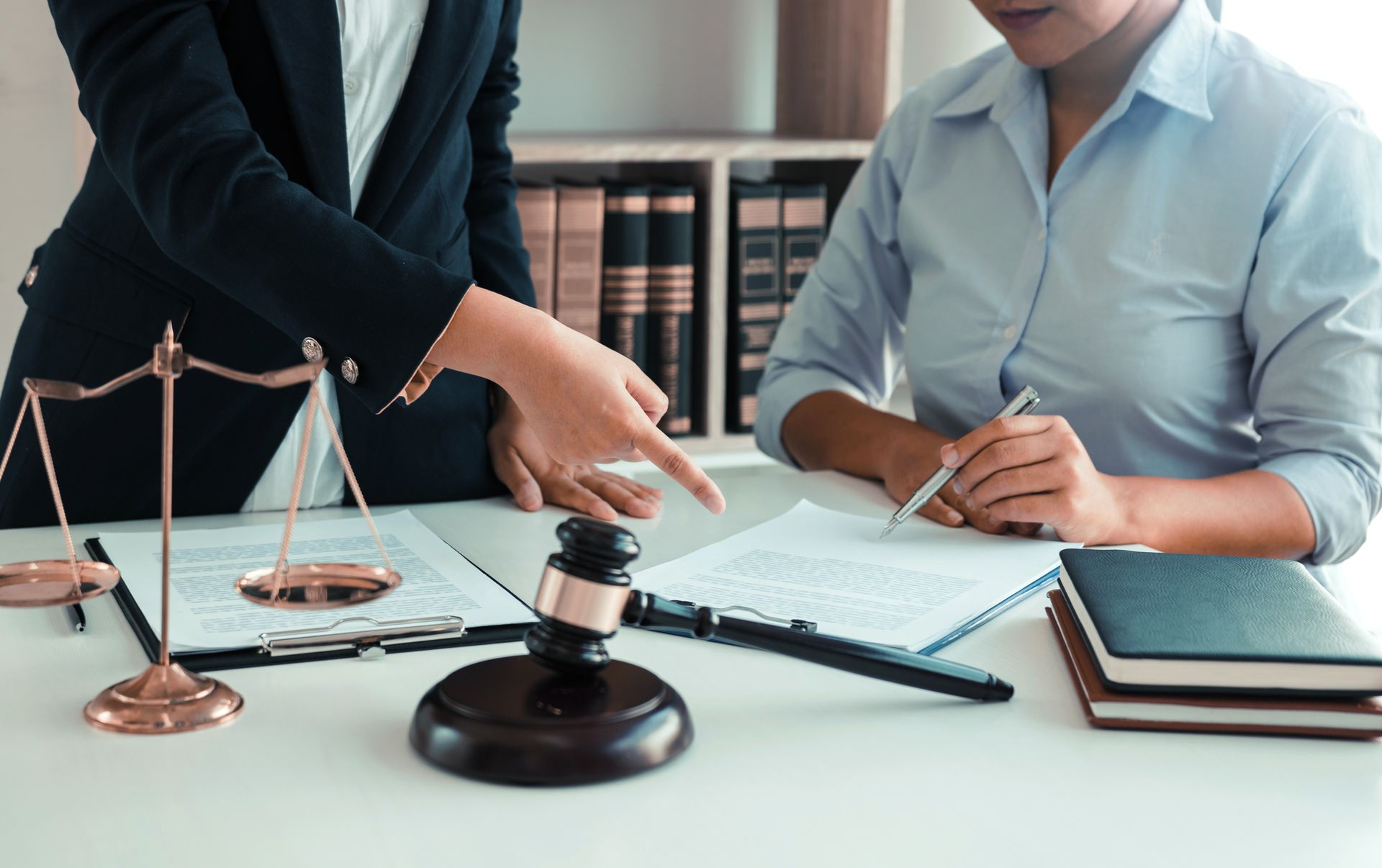 A lawyer is currently advising a client on her requests for legal proceedings and legal advice.