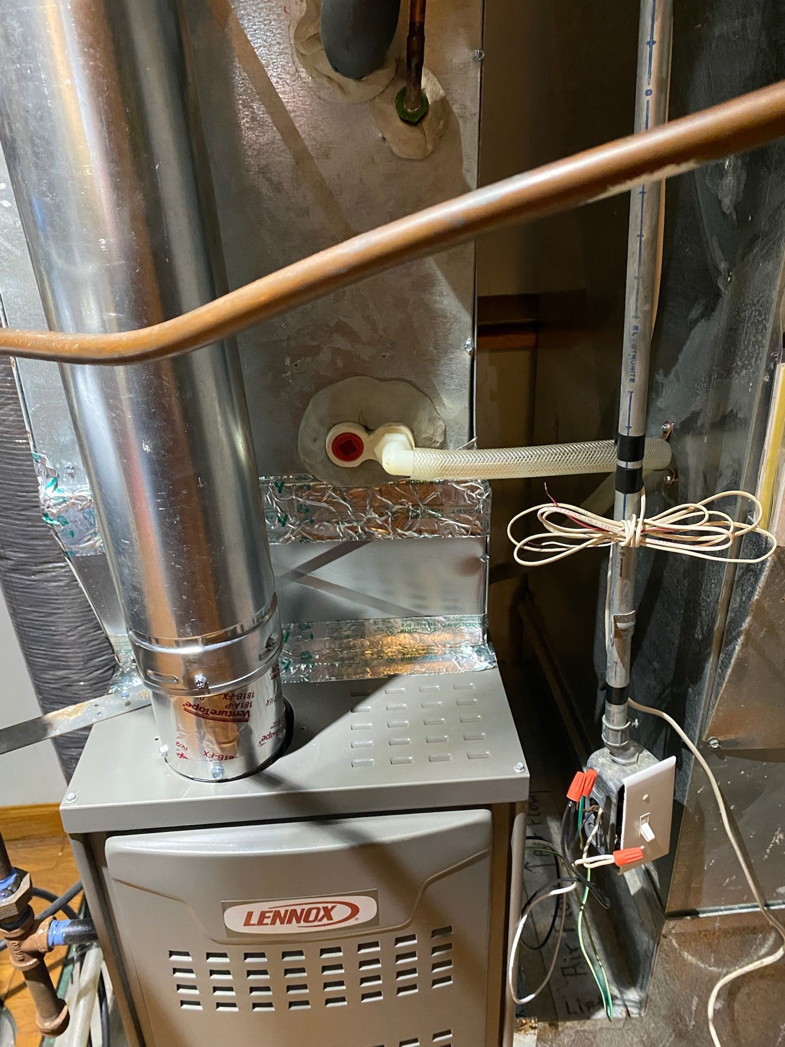 HVAC technician working on outdoor unit, showcasing expert furnace repair services