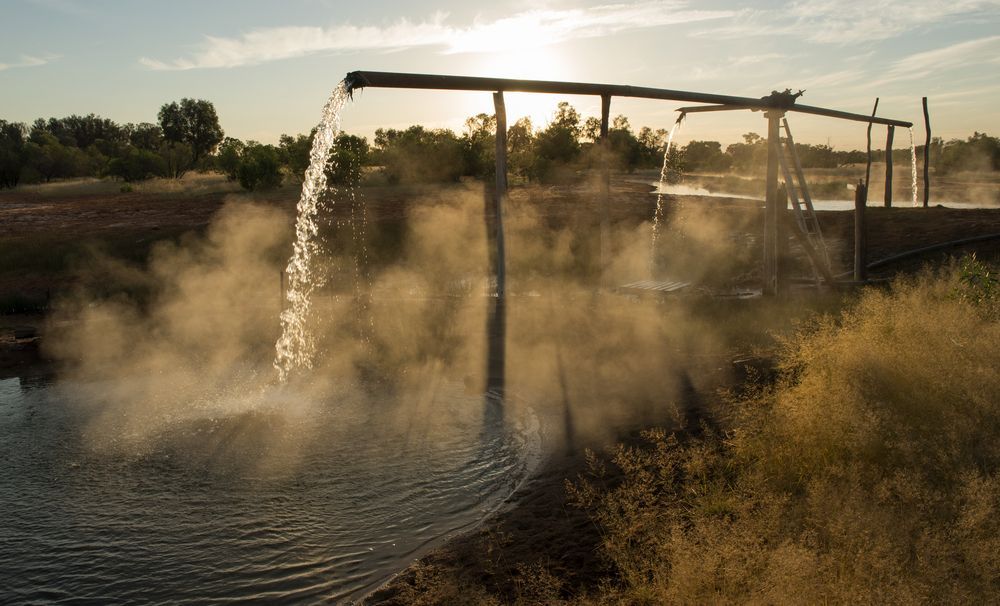 A Water Pump is Spraying Water Into a Body of Water — Cheyenne Drilling on the Sunshine Coast, QLD