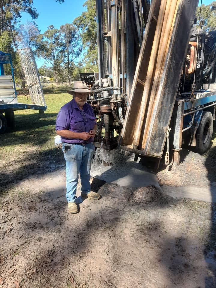 A Man is Standing in Front of a Large Machine — Cheyenne Drilling on the Sunshine Coast, QLD