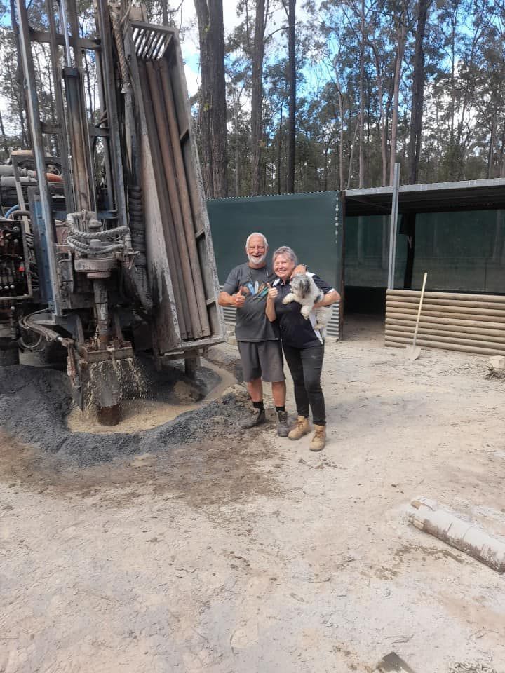 A Man and a Woman Are Standing in Front of a Machine — Cheyenne Drilling in Eumundi, QLD