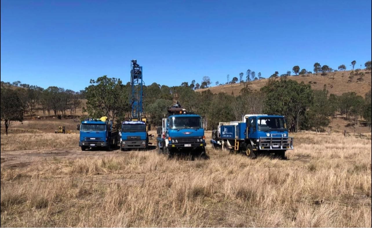 A Row of Blue Trucks Are Parked in Front of a Building — Cheyenne Drilling on the Sunshine Coast, QLD