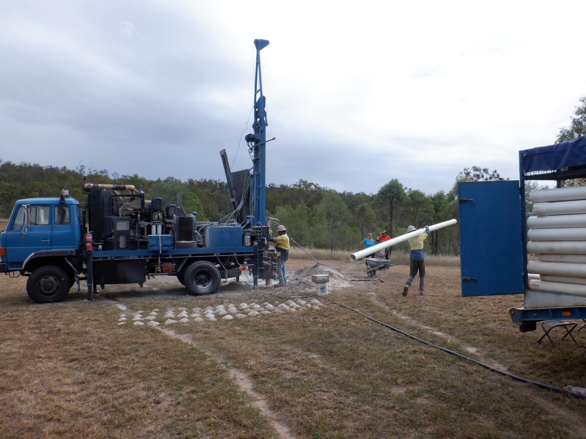 A Blue Truck is Parked in the Middle of a Field — Cheyenne Drilling on the Sunshine Coast, QLD