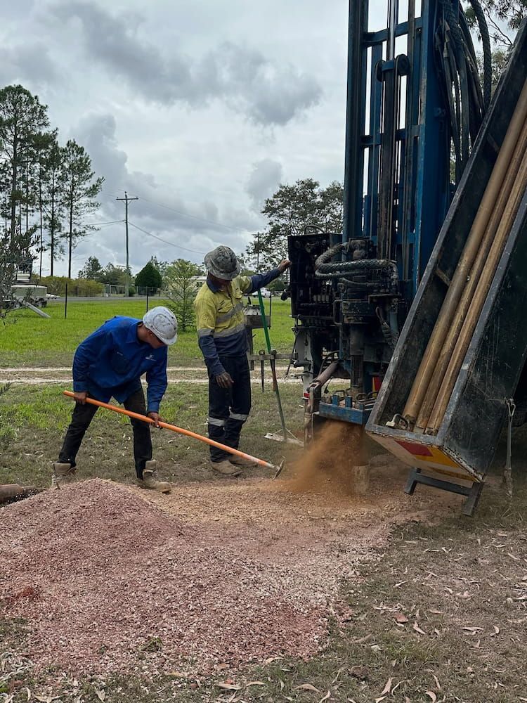 Two Men Are Working on a Drilling Rig in a Field — Cheyenne Drilling on the Sunshine Coast, QLD