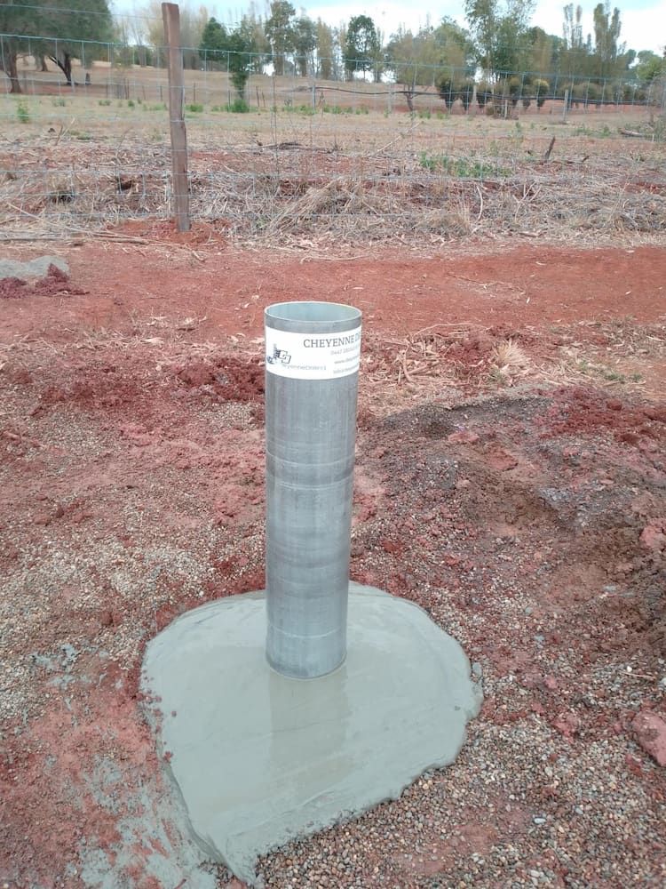 A Metal Pole is Sitting in the Middle of a Dirt Field — Cheyenne Drilling on the Sunshine Coast, QLD