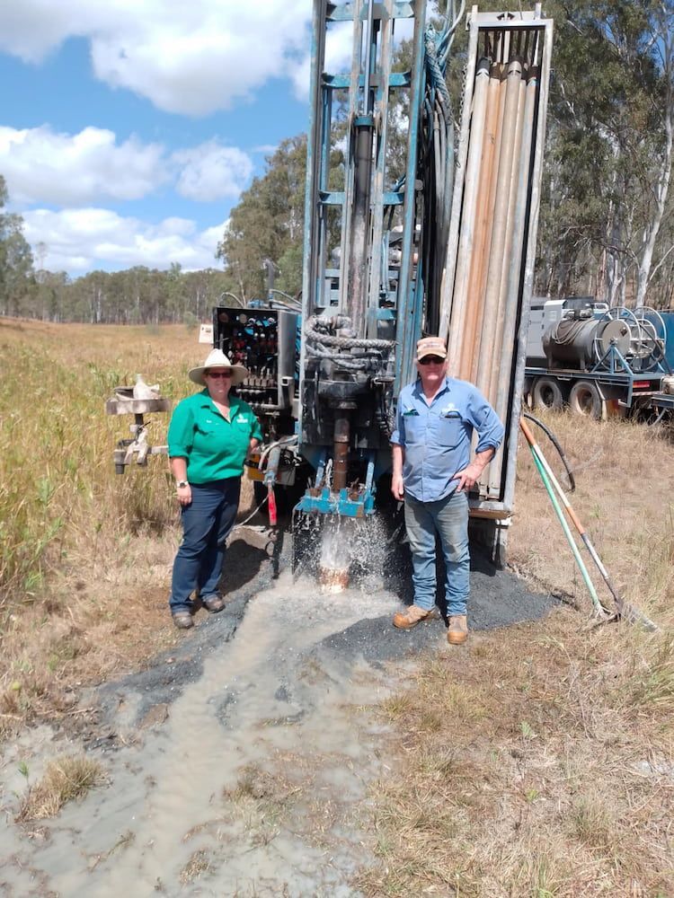 Two Men Are Standing in Front of a Large Machine in a Field — Cheyenne Drilling in Hervey Bay, QLD