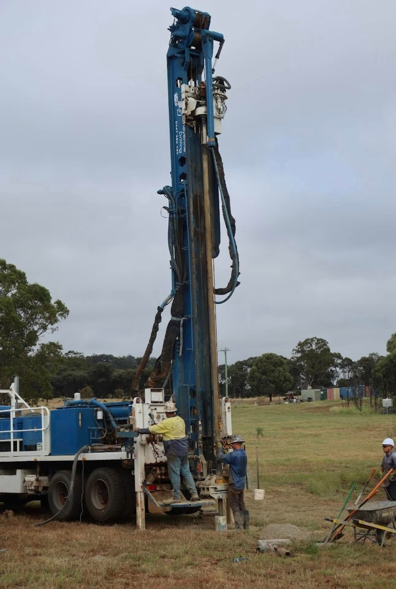 A Group of Men Are Working on a Large Machine in a Field — Cheyenne Drilling in Kingaroy, QLD