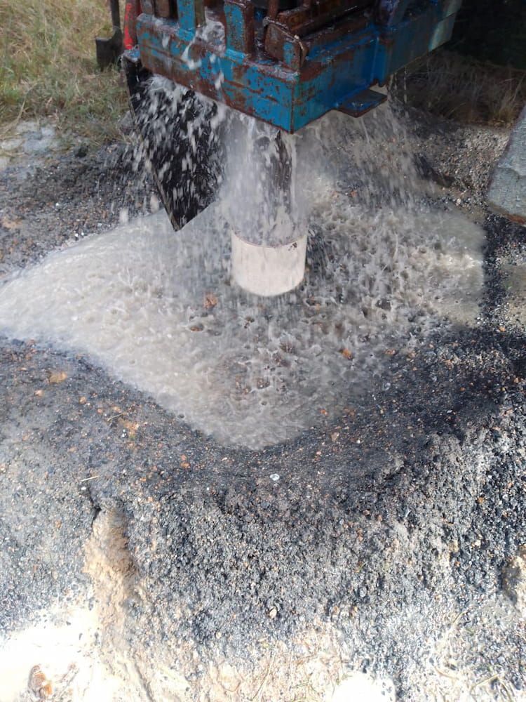 A Machine is Drilling a Hole in the Ground and Water is Coming Out of It — Cheyenne Drilling on the Sunshine Coast, QLD