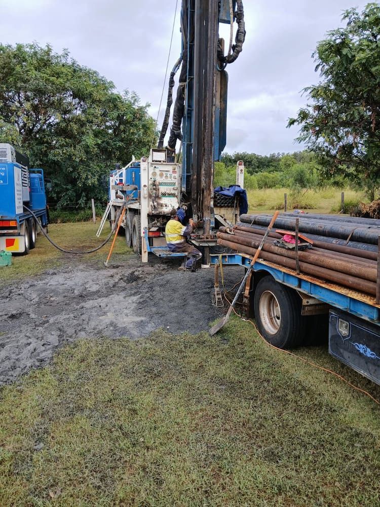 A Man is Sitting on the Back of a Truck — Cheyenne Drilling on the Sunshine Coast, QLD