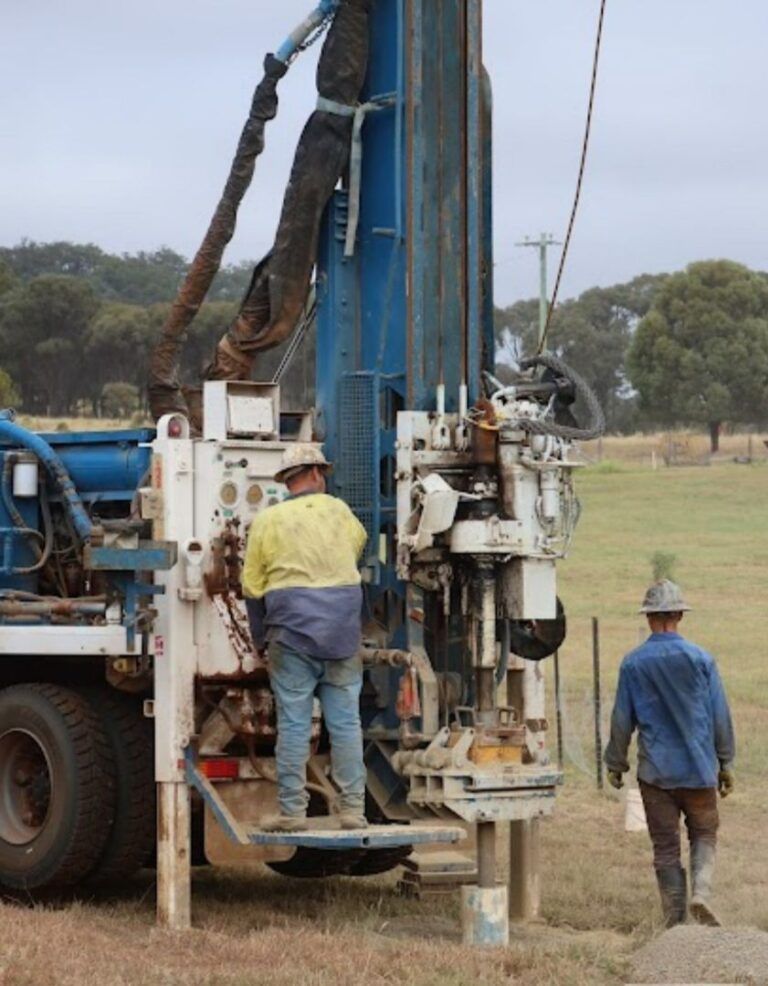 Two Men Are Working on a Machine in a Field — Cheyenne Drilling on the Sunshine Coast, QLD