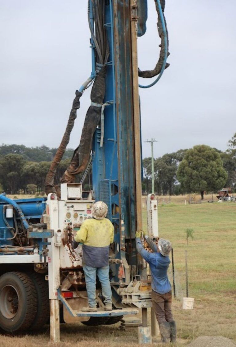 Two Men Are Working on a Large Machine in a Field — Cheyenne Drilling on the Sunshine Coast, QLD