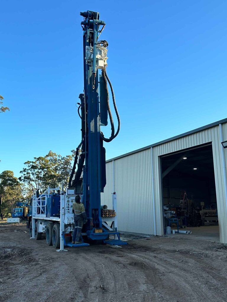 A Large Blue Machine is Parked in Front of a Building — Cheyenne Drilling on the Sunshine Coast, QLD