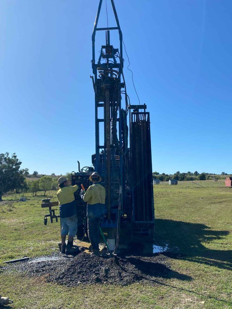 A Group of People Are Working on a Large Machine in a Field — Cheyenne Drilling on the Sunshine Coast, QLD