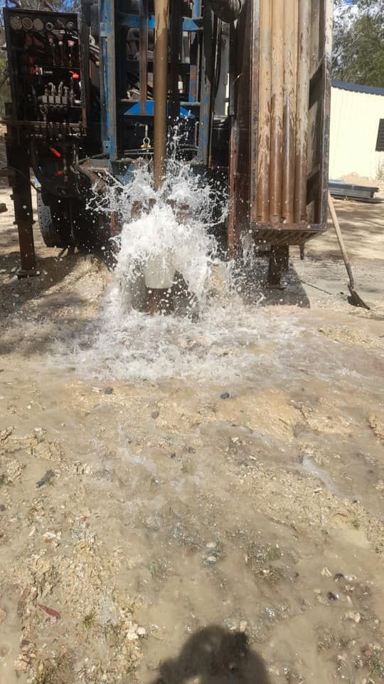 A Water Well is Being Drilled Into the Ground and Water is Coming Out of It — Cheyenne Drilling on the Sunshine Coast, QLD