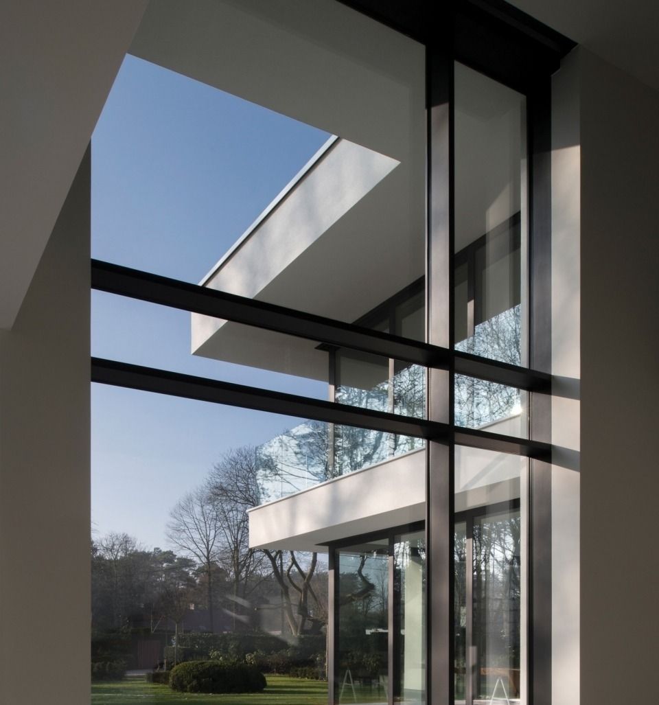 A house with a lot of windows and a balcony