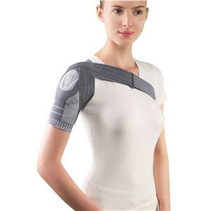 A woman is wearing a shoulder brace on her shoulder.