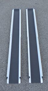 handicapped person backing his wheelchair onto a lift van — Healthcare Equipment in Lake Macquarie