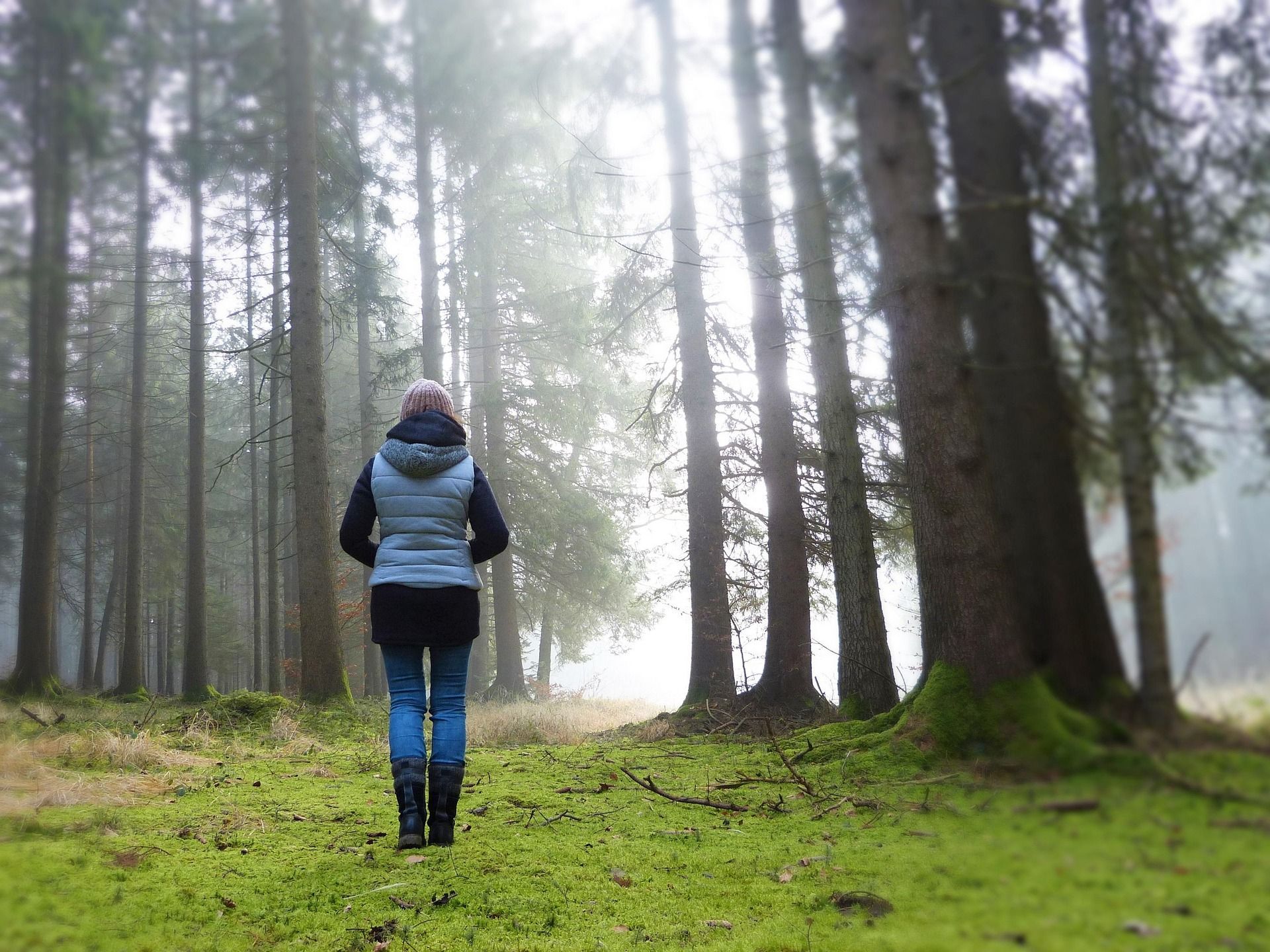 woman walking in the woods