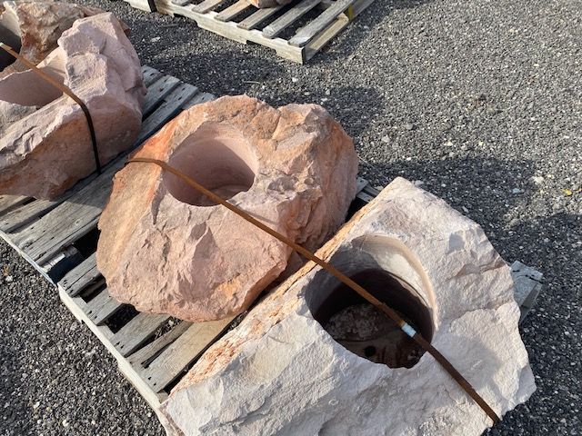 A bunch of rocks sitting on a wooden pallet
